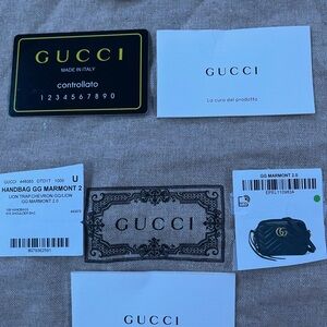 Gucci Black Leather Handbag with Gold Accents